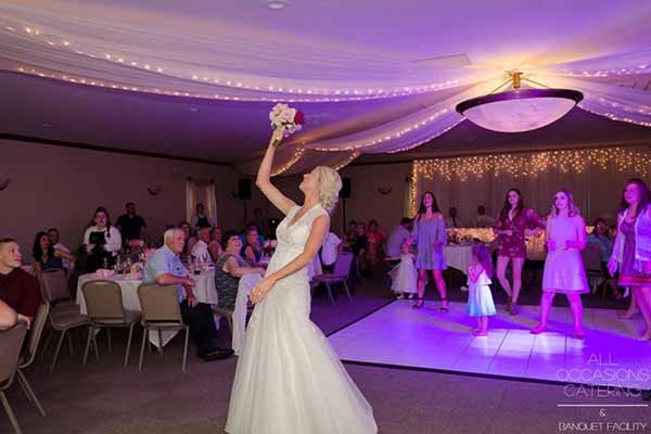 Radnor-600x400-Hori-9 A bride tosses her bouquet at a country themed wedding